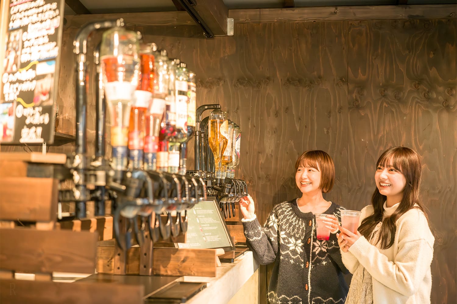 Photo of women drinking hot drinks