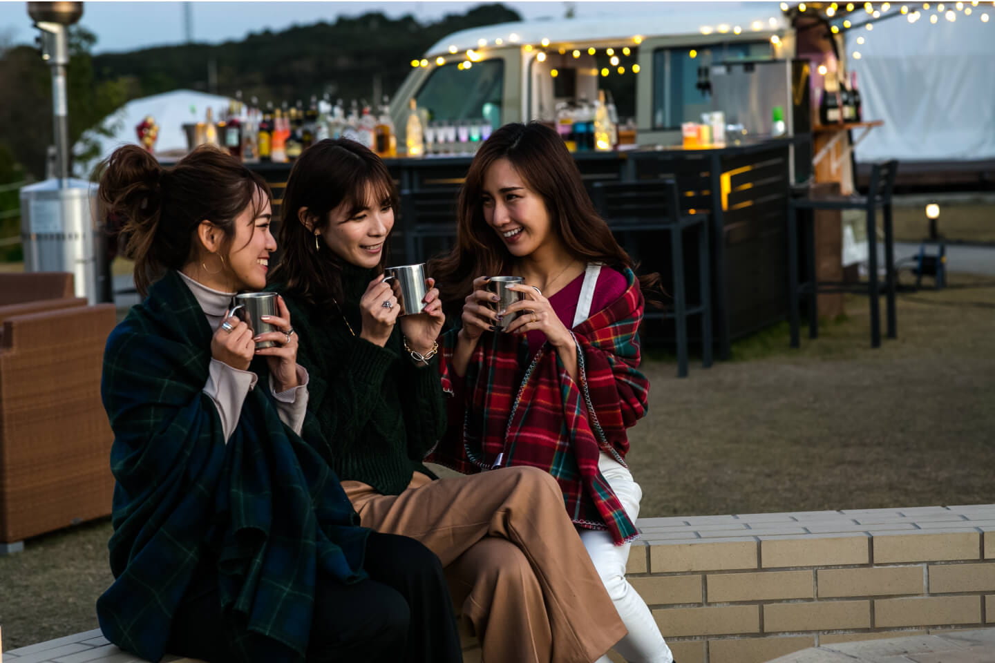 Photo of women drinking hot drinks