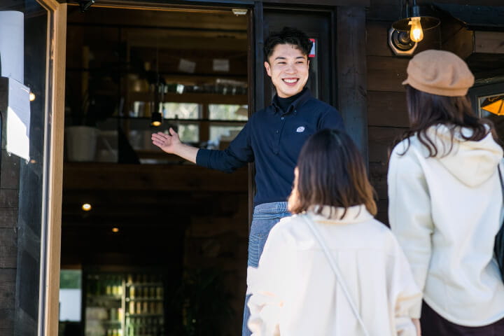 Photo of staff guiding customers