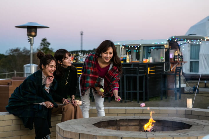 Photo of women enjoying roasted marshmallows